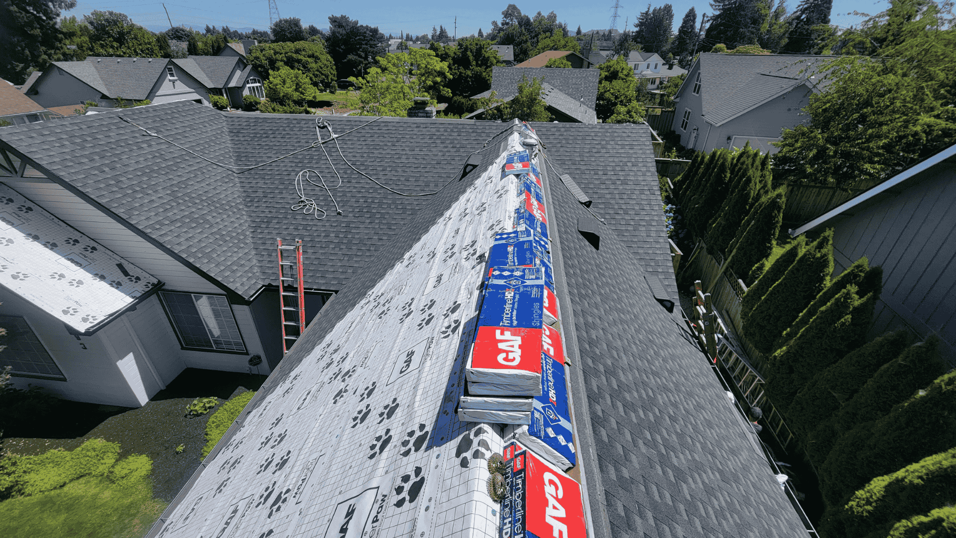 Skilled technician from Pressure Point Roofing Eugene, LLC. inspecting roof damage in Florence OR, preparing for expert repair