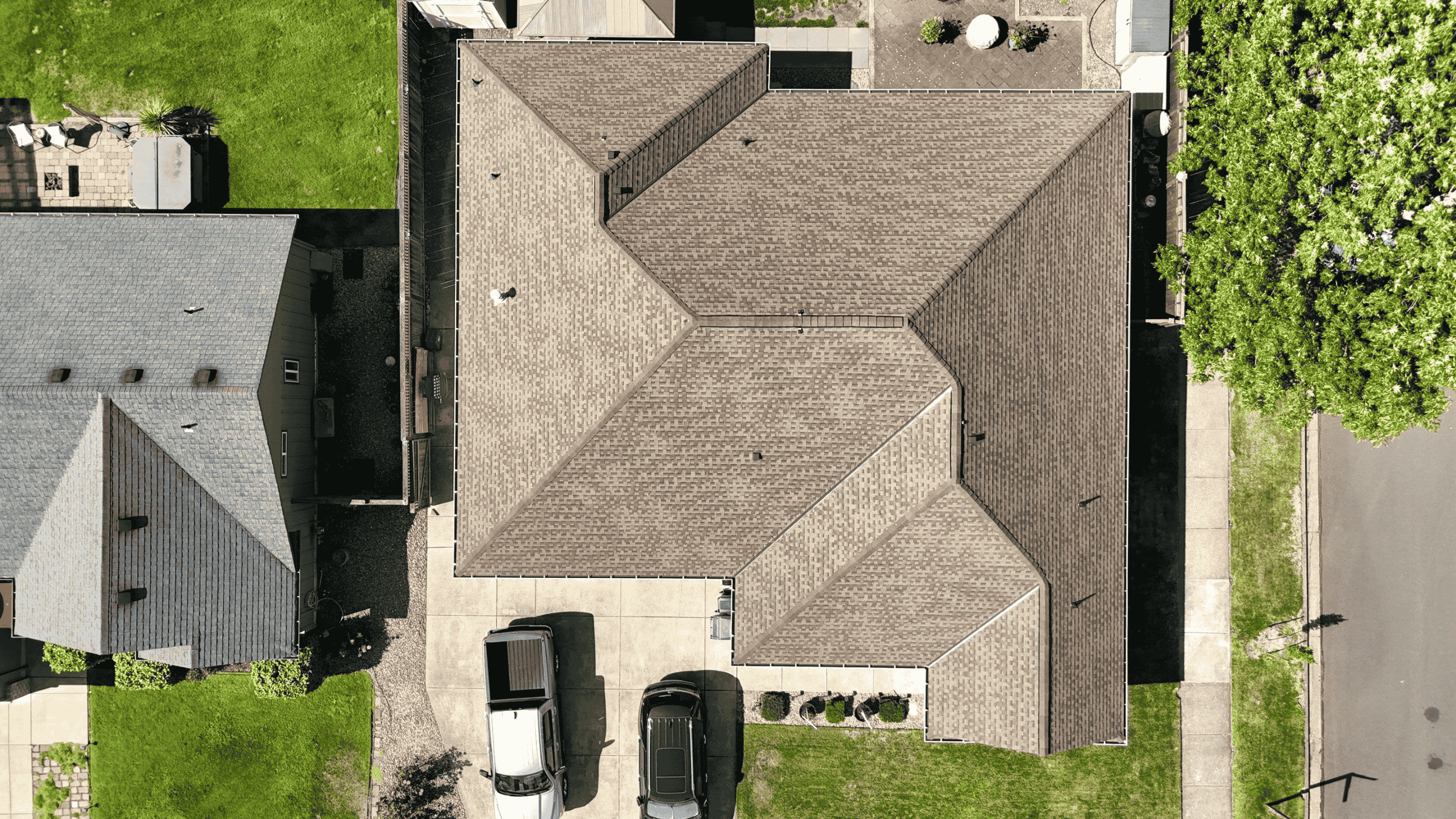 Experienced roofer inspecting severe roof leak in Albany, OR commercial property during emergency call