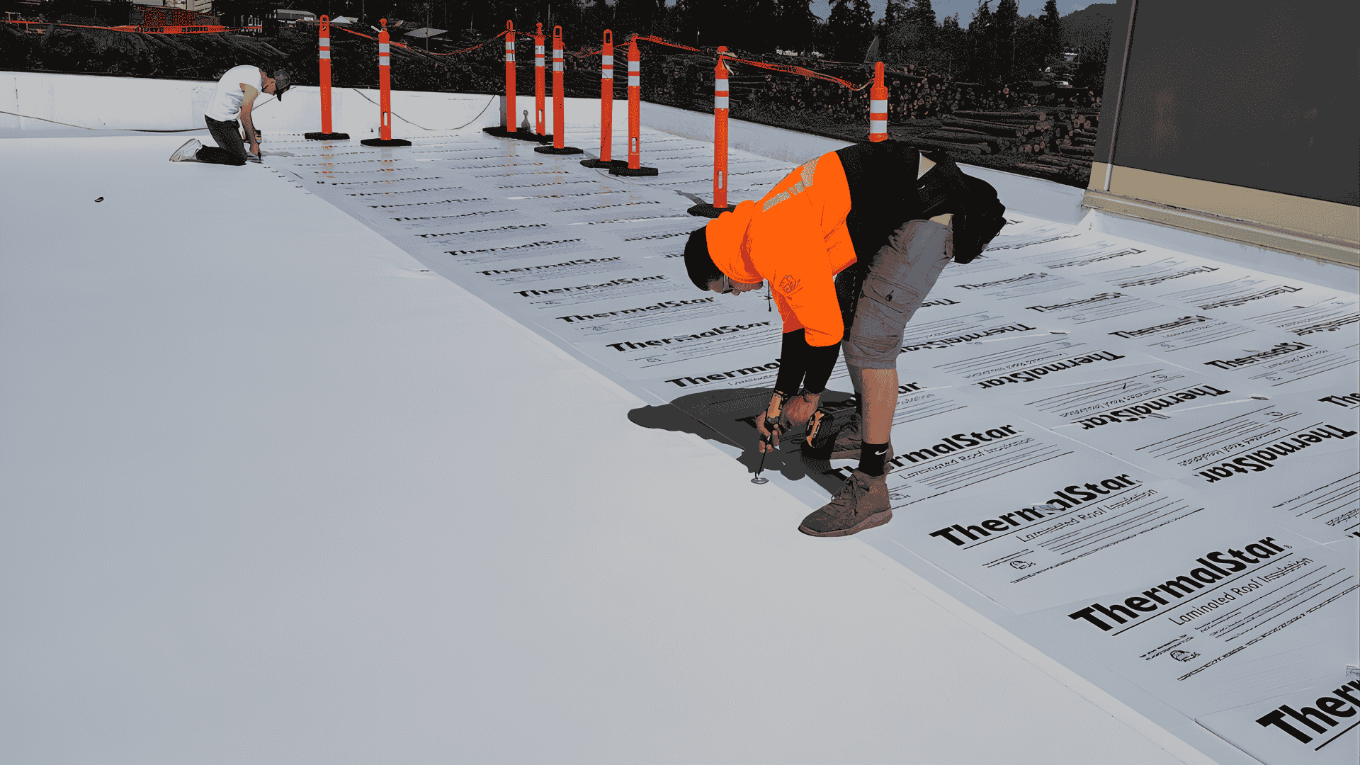 Professional roofing team ensuring safety and quality compliance on a commercial roofing project in Springfield OR