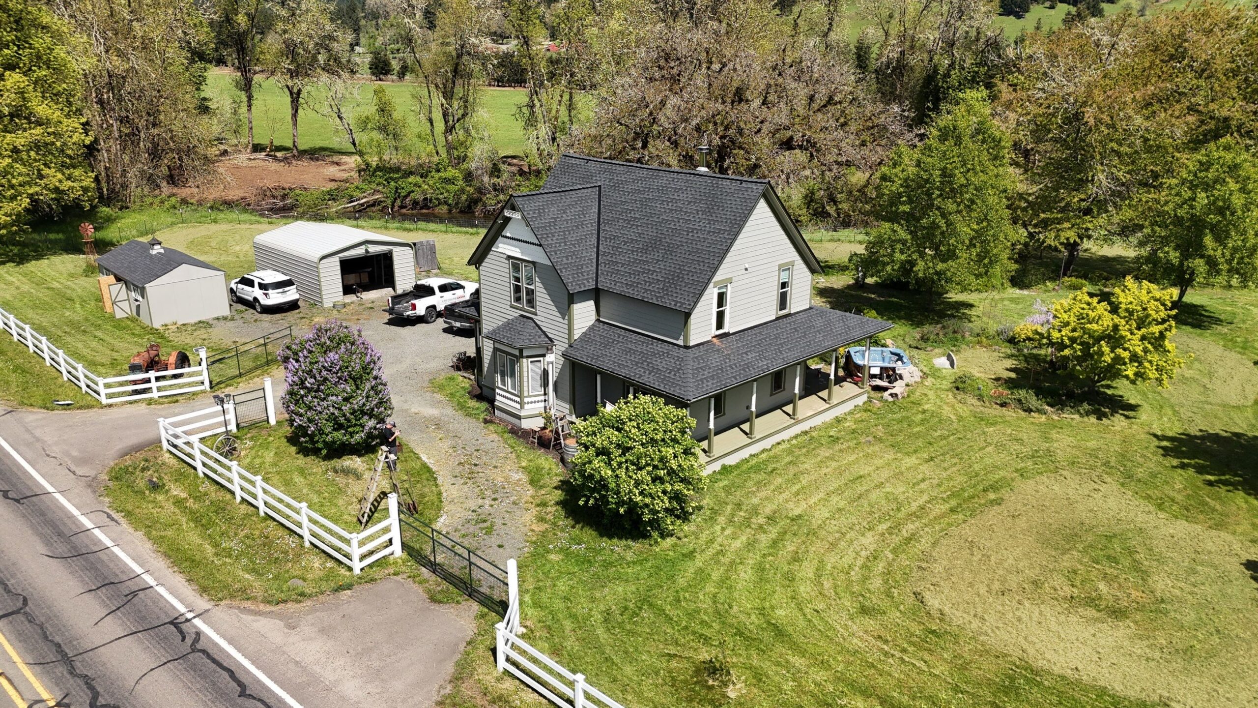 Roofing professional inspecting underlayment and flashing details on a Cottage Grove home