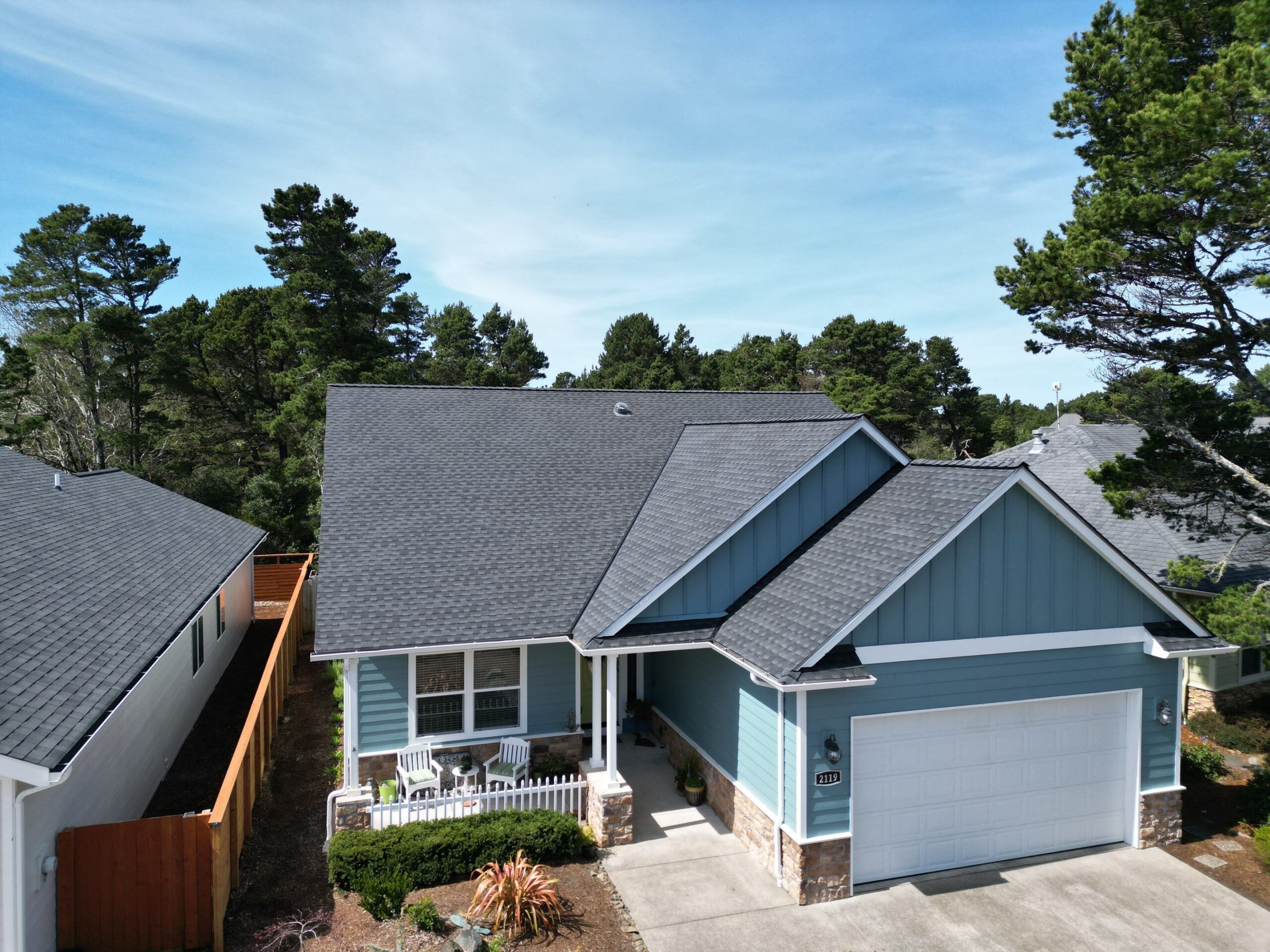 Pressure Point Roofing Eugene, LLC. expert assessing roof structure for optimal energy efficiency