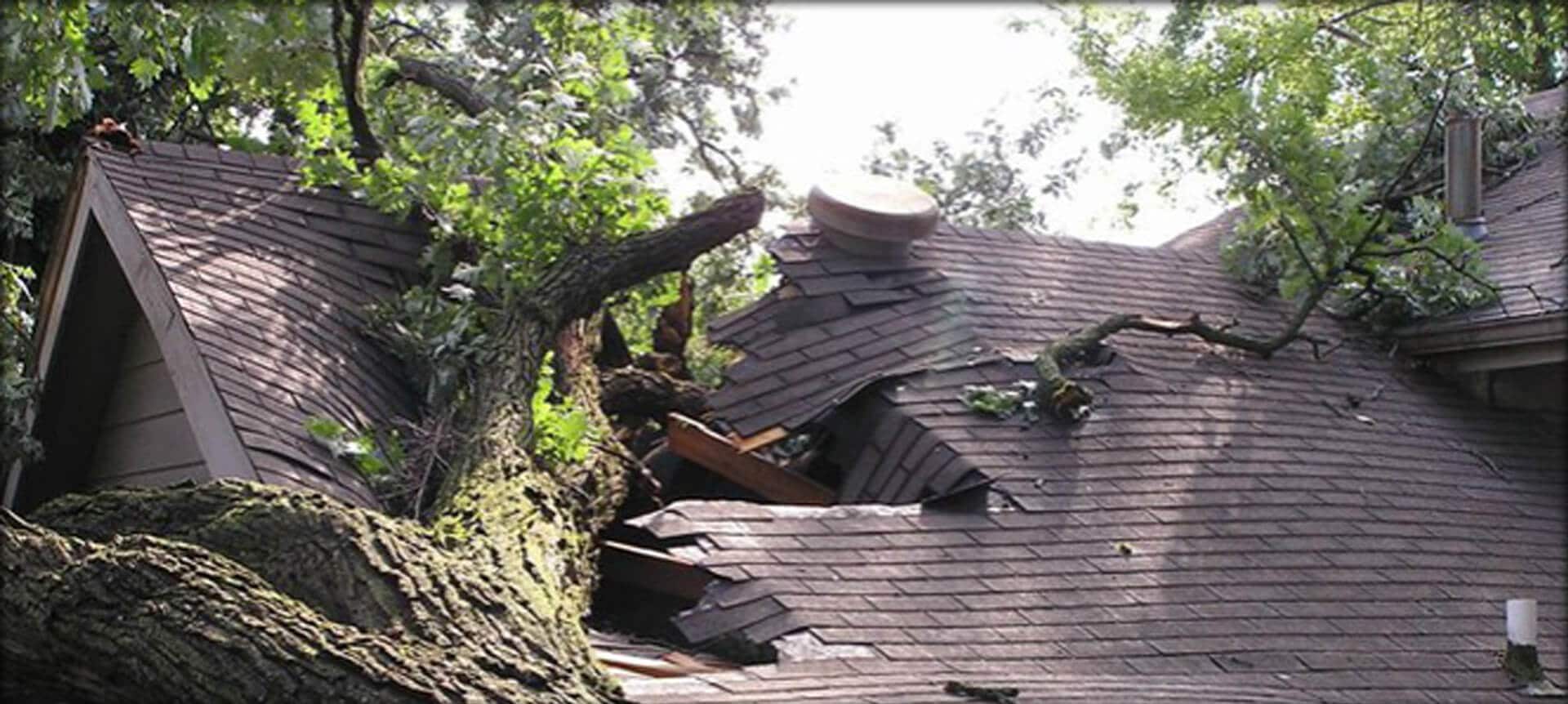 Roofing crew performing emergency storm damage repairs on a residential home in Junction City, OR after severe wind and rain